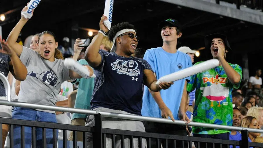 Fans cheer enthusiastically from the stands