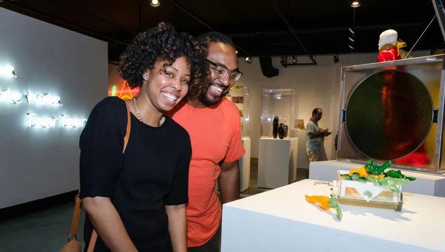 Patrons enjoy an art exhibit