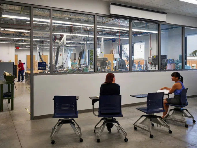 Students are seated adjacent to the lab