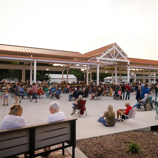 Legacy Square offers an open market feel with coverd parking options. The space is utilized for a variety of events such as outdoor concerts, farmers markets and church services. 