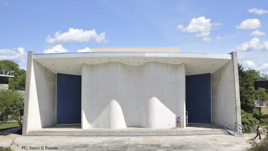 A large white and wavy building.