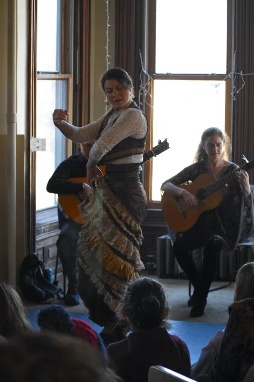 Flamenco dancer dancing with guitarists