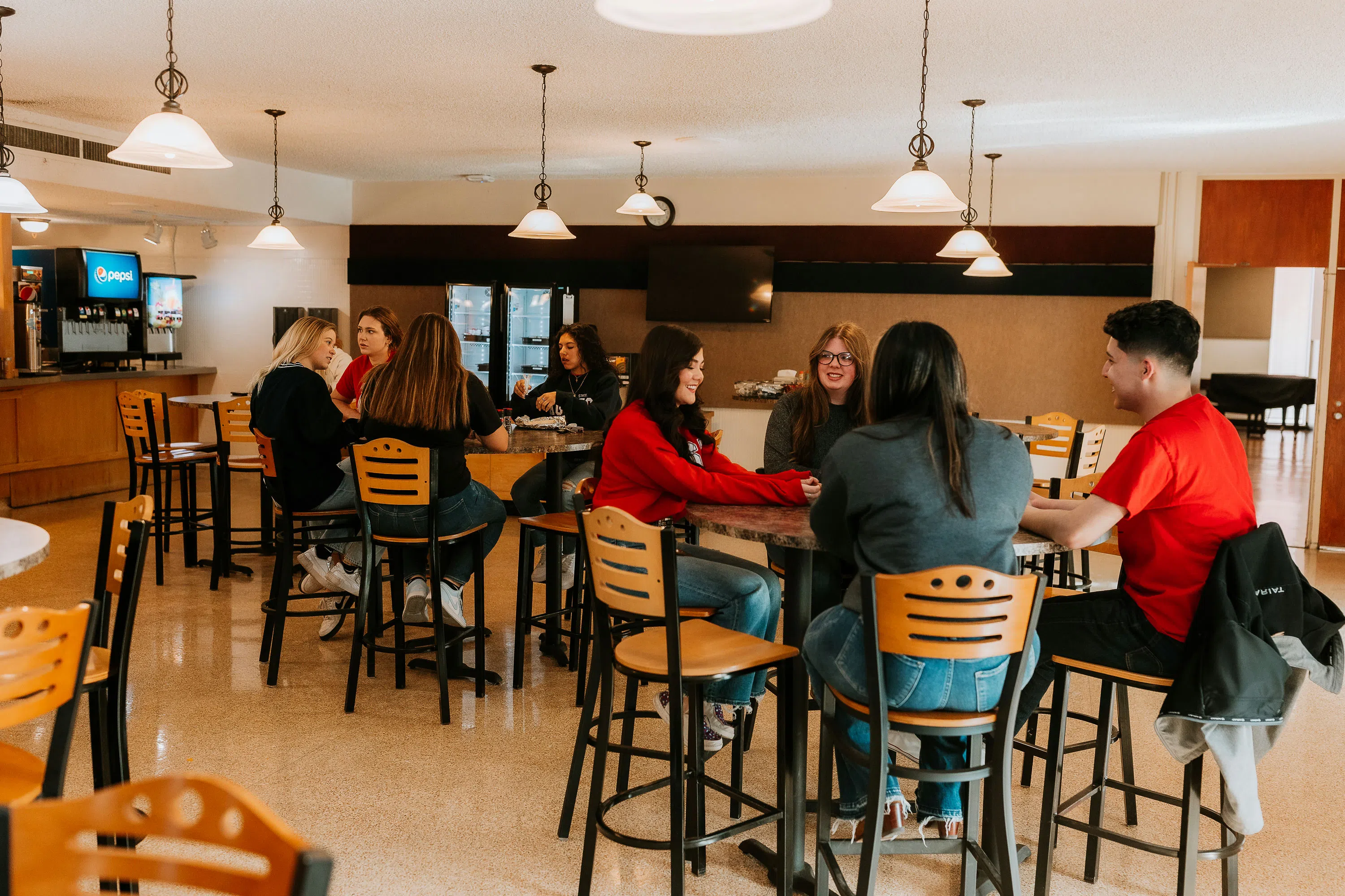 Students sitting inside the Aggie Grill