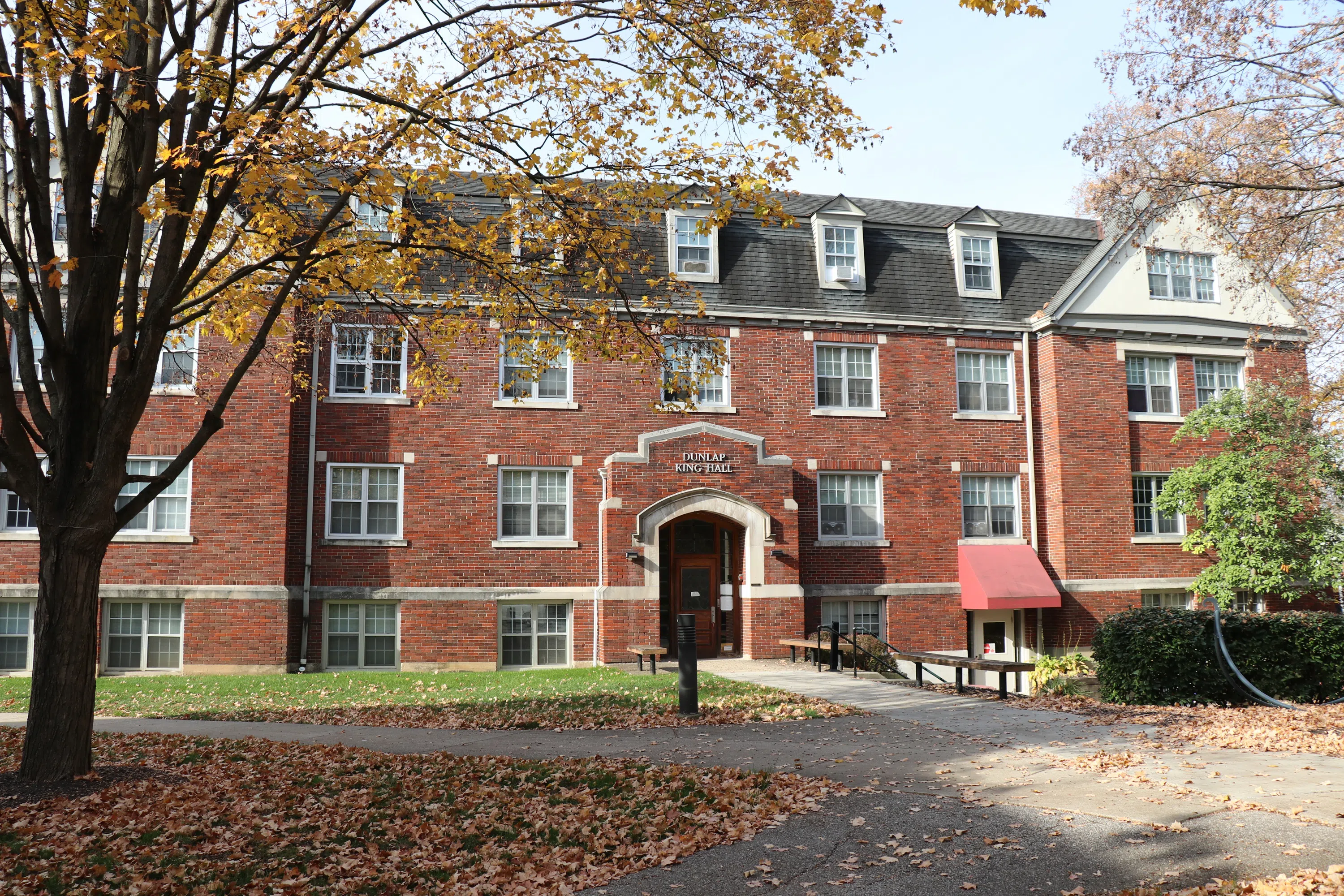 Main view of DK Hall, a four story brick building in a classic style.