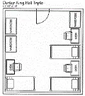 A triple occupancy room with two beds and two desks on one side and a third bed with a desk opposite, three dressers.