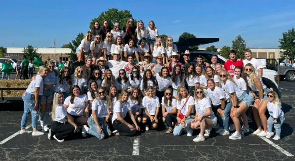 Large group of sorority and fraternity members at Homecoming Parade.