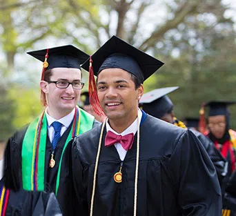 Otterbein Students pose in graduation regalia. 