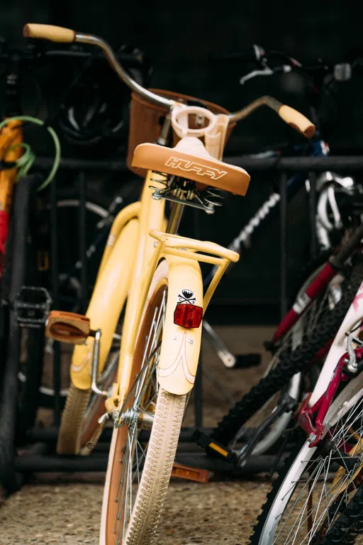 A bycicle in a rack outside the Library.