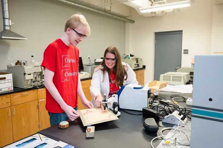 Two people studying in a chemistry lab