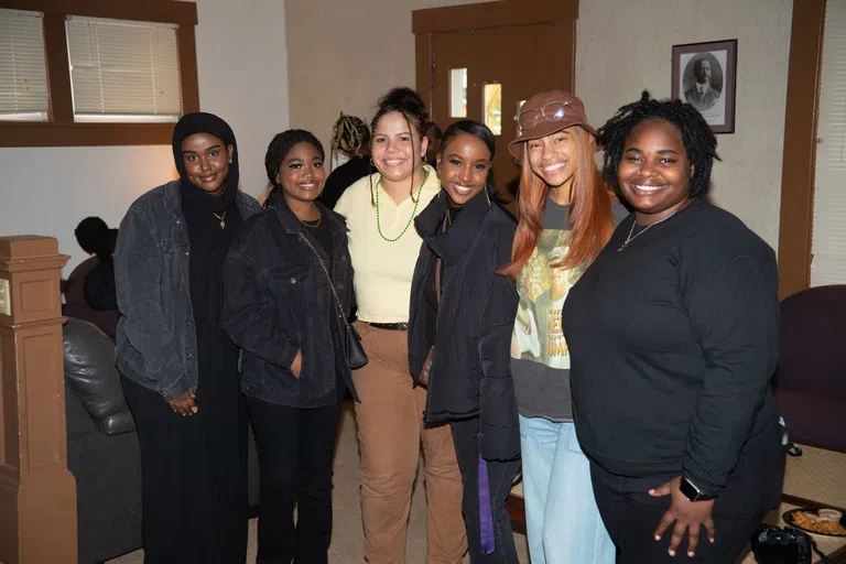 A group of students smile for the camera. 