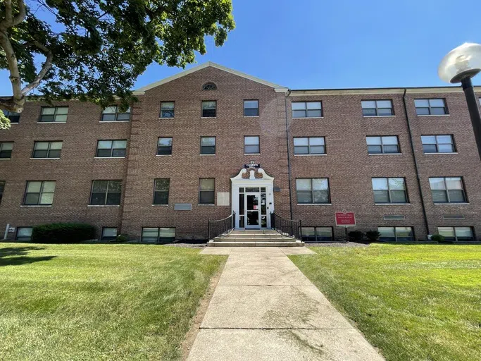 Brick building with white entryway