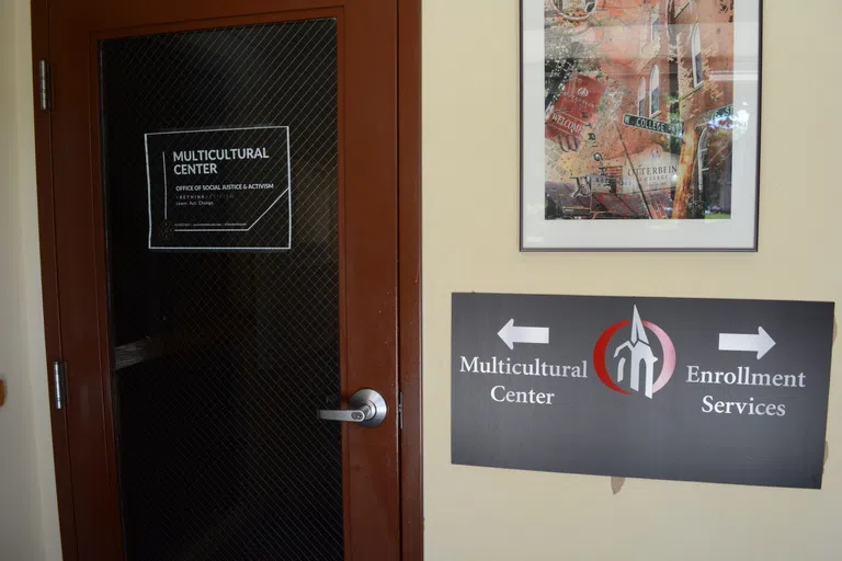 An view inside the Barlow Hall vestibule shows the front door of the Office of Social Justice & Activism.