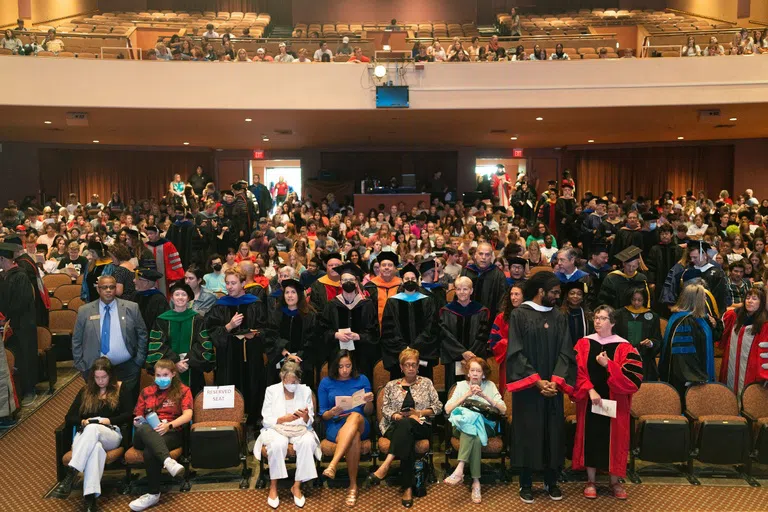 A group of students in the audience of the theater 