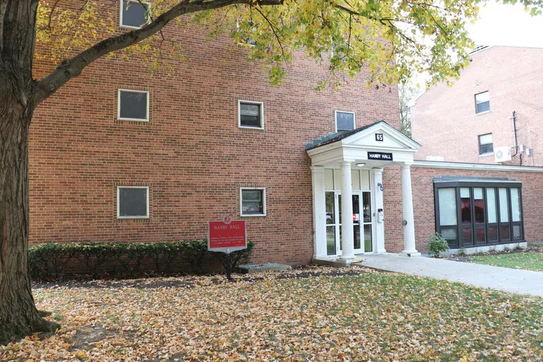 Hanby Hall main entrance. Tall brick walls with a white portico.