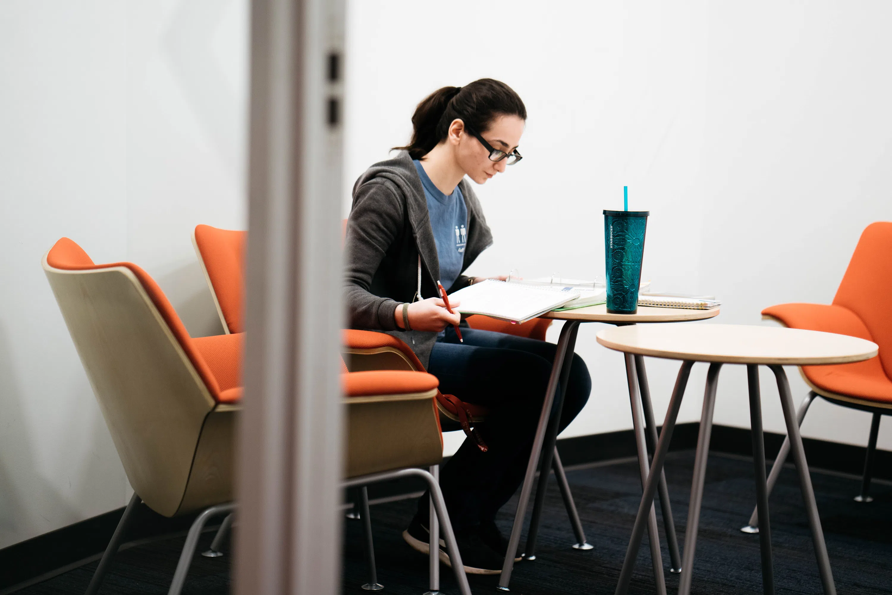 A student sits in one of the individual study rooms at The Point.