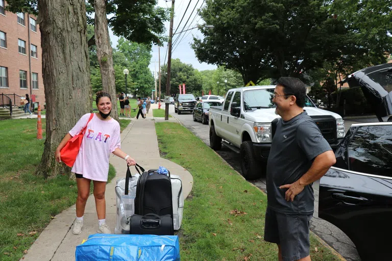 A sorority member and her parent during move-in day