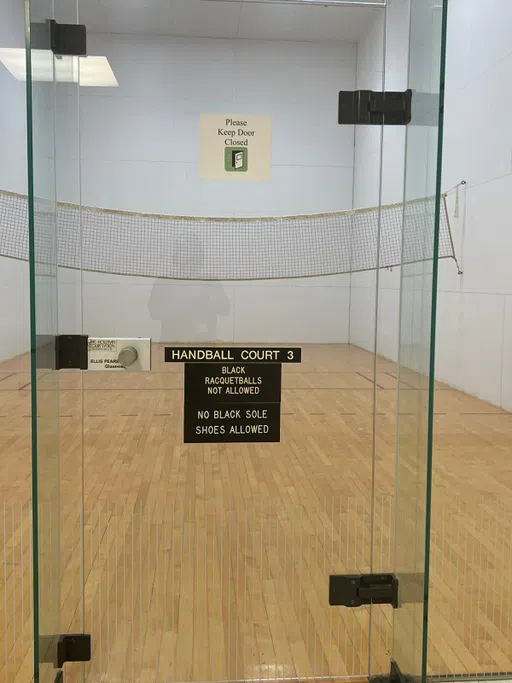 Handball Racquetball Court with Net. Handball Court 3. Black Racquetballs Not Allowed. No Black Sole Shoes Allowed.