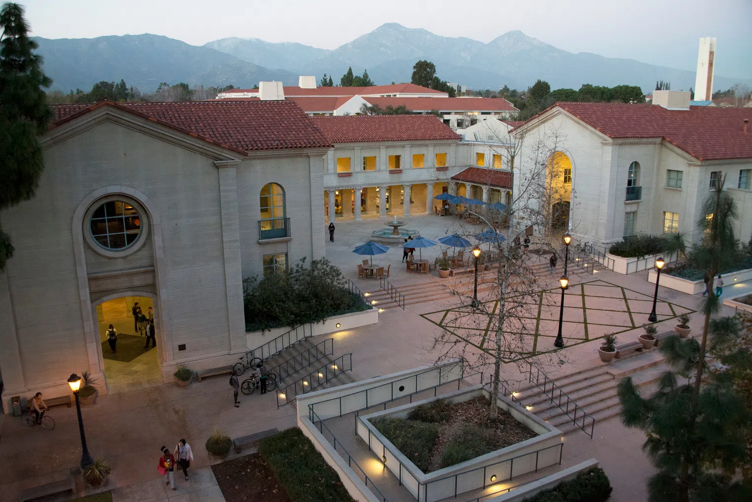 Aerial view of Smith Campus Center at night with students