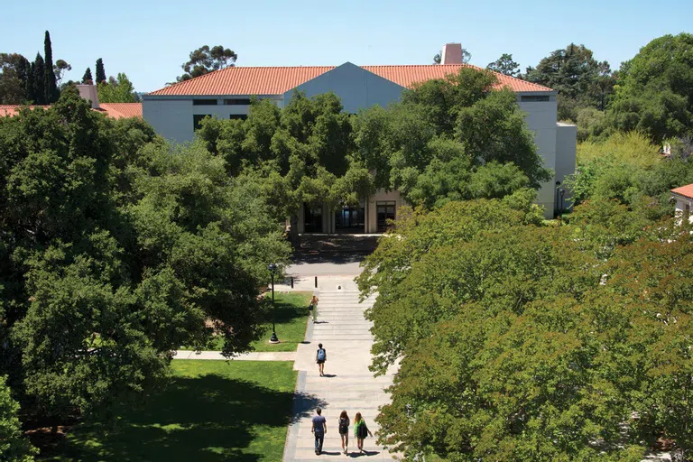 Aerial view of Edmunds Hall with trees and students