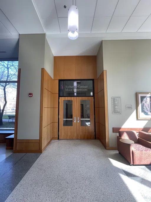 The photo shows the entrance doors to the mock courtroom