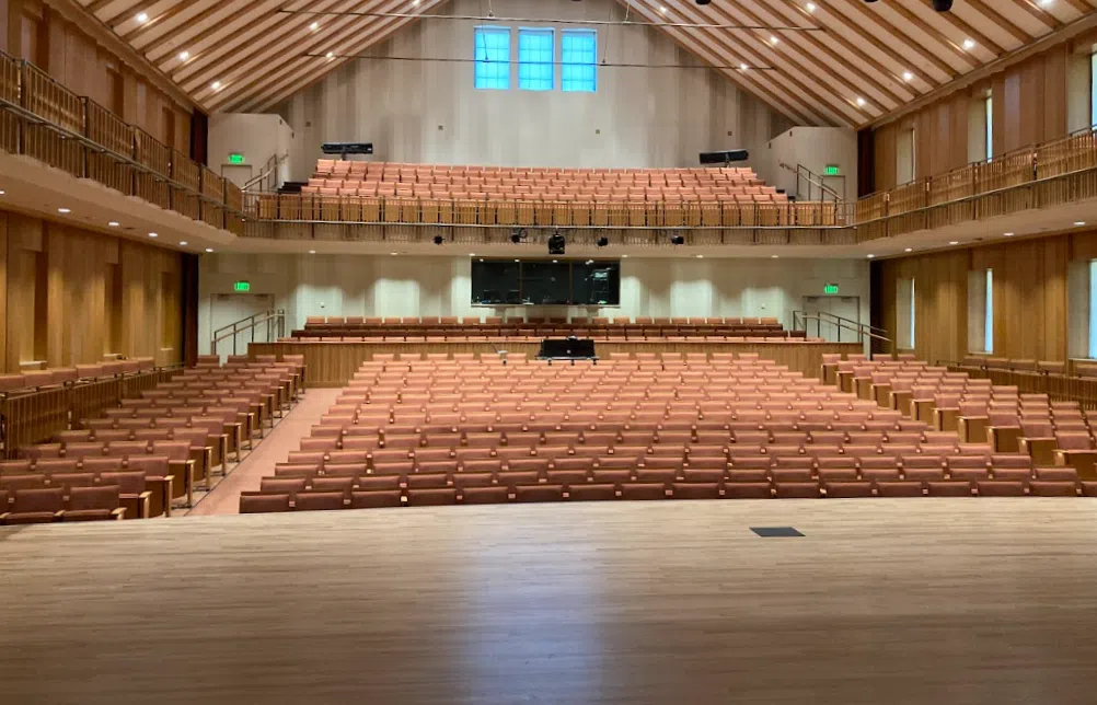 A photo taken from the stage of the concert hall looking to the audience.