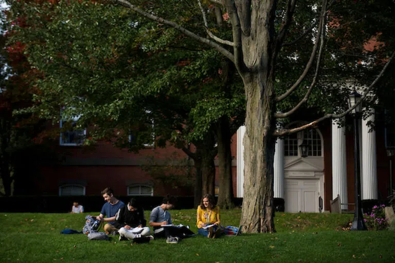 Students sitting on the President's Lawn