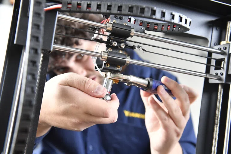 A student working on an invention in the Maker Lab 