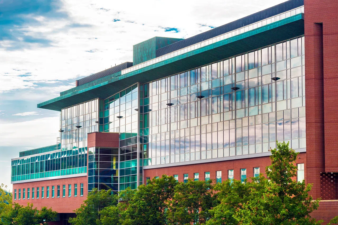 Exterior shot of the Life Sciences Building highlighting the unique green glass windows. 