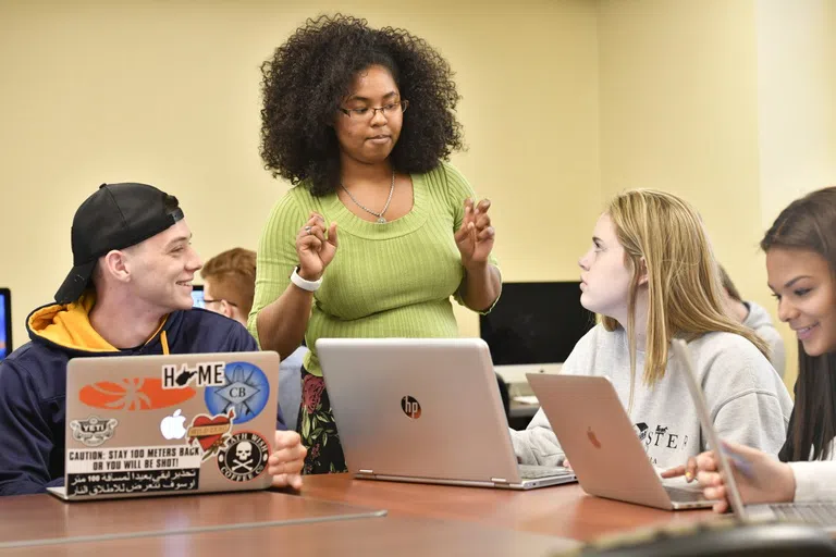 A student tutors fellow students in the Eberly Writing Studio 