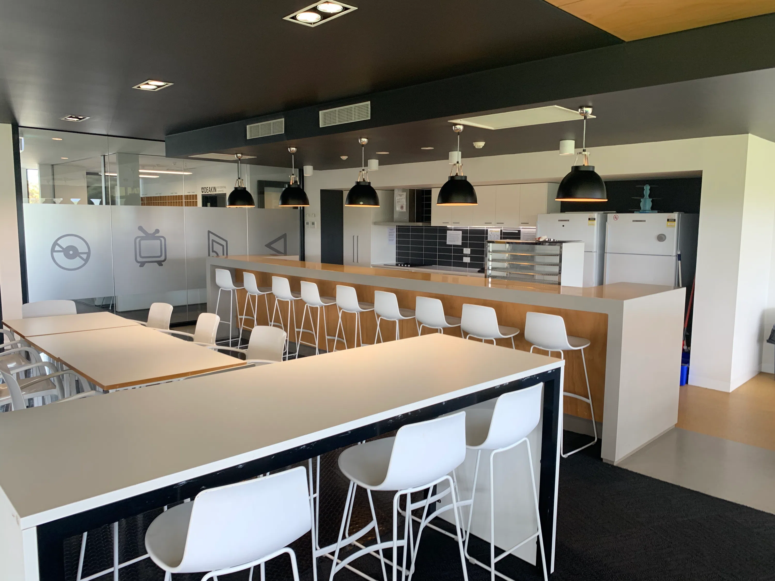 Study room in residence hall equipped with tables and chairs 