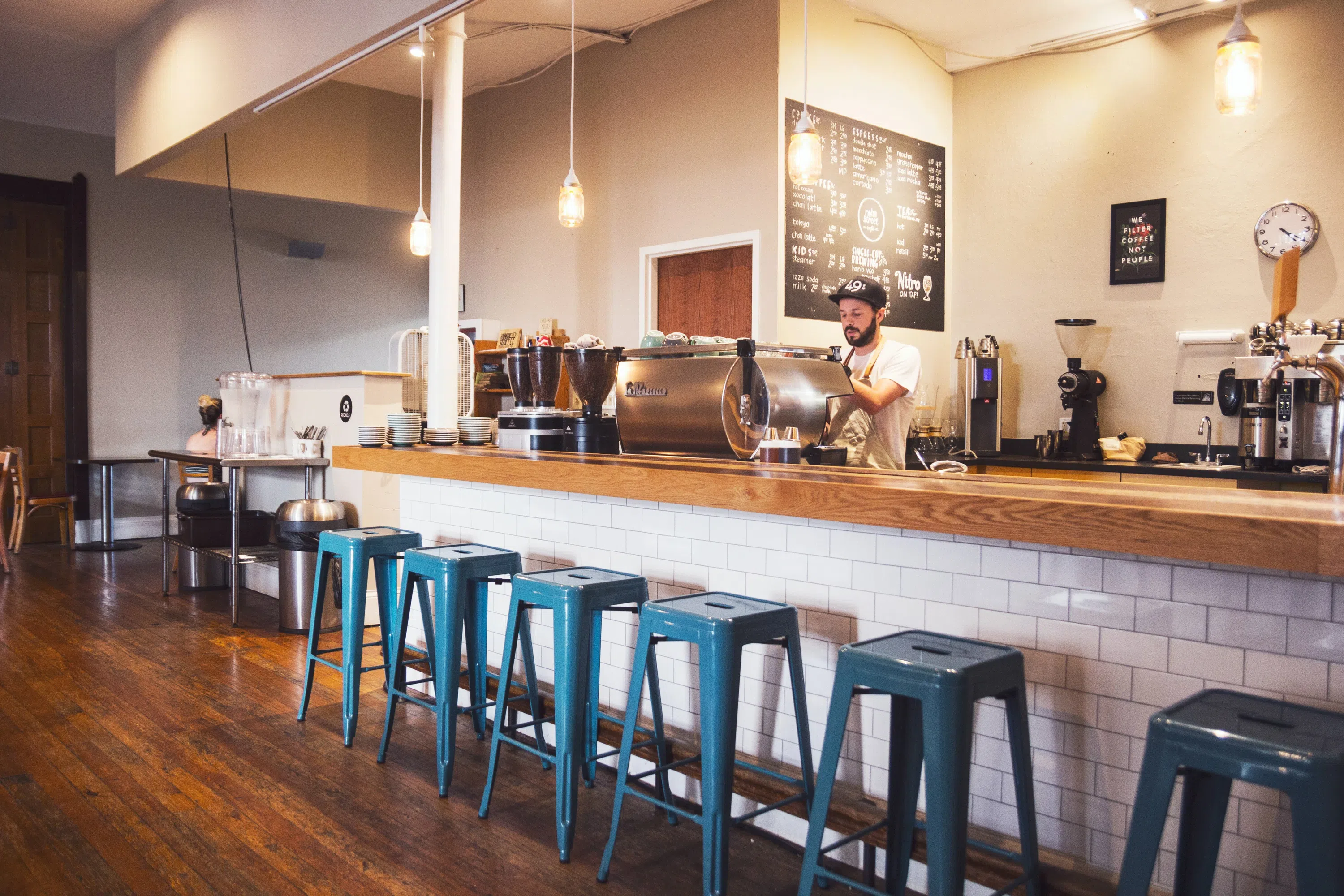 Mocha Mocha coffee bar - bar stools lined up with man at cash register