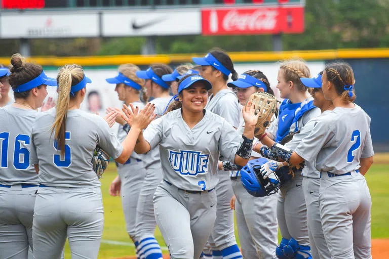 Softball team entering field