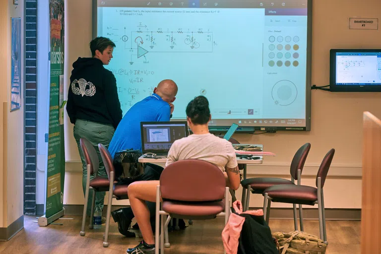 Students study math in the John C. Pace Library in one of the study rooms.