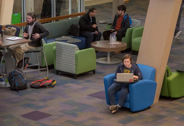 Students in the Great Hall in the University Commons at the University of West Florida.