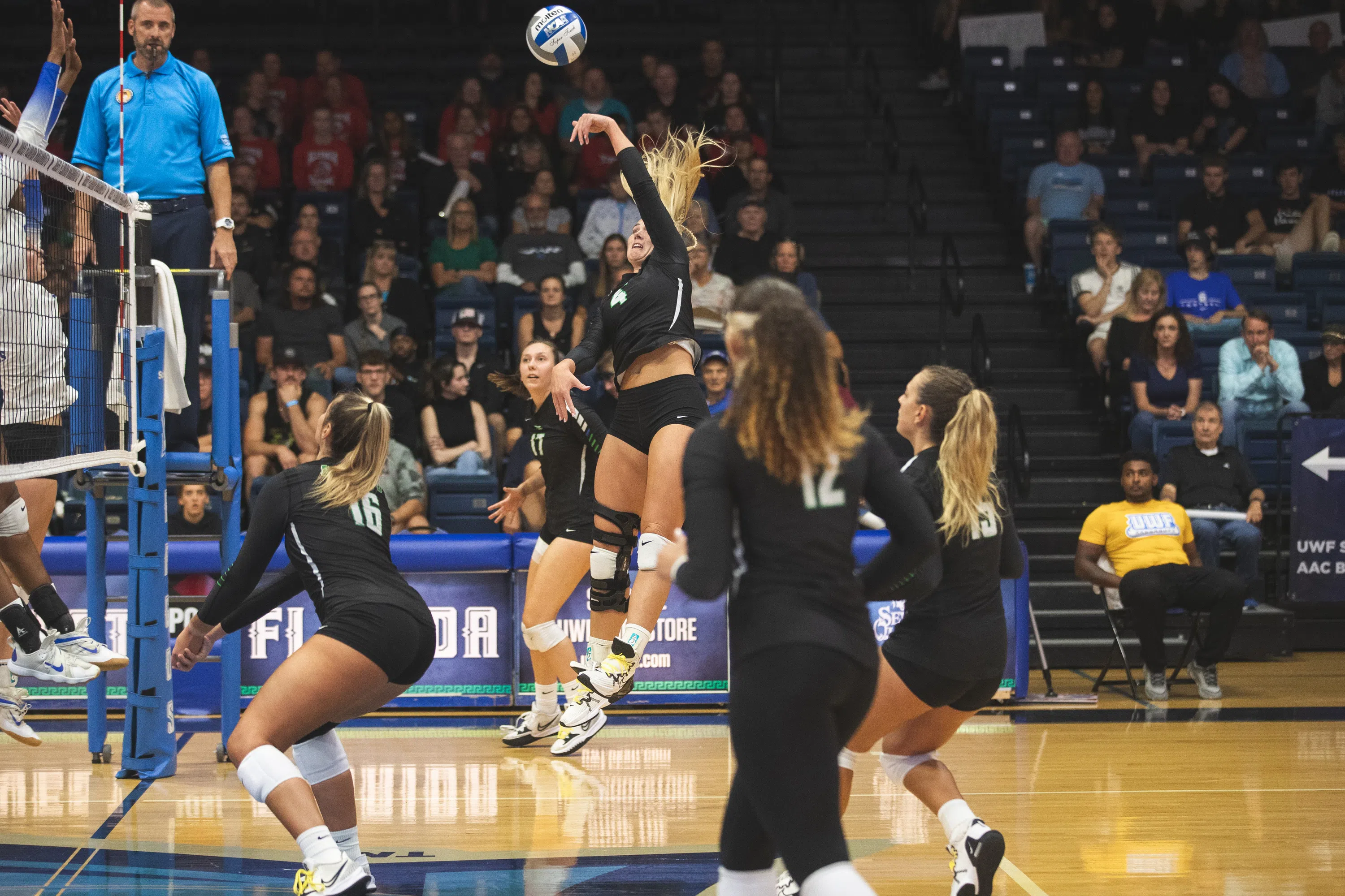 Women volleyball  players playing in the field house