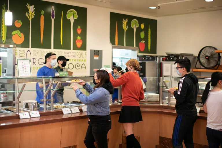 Students get food at the dining hall