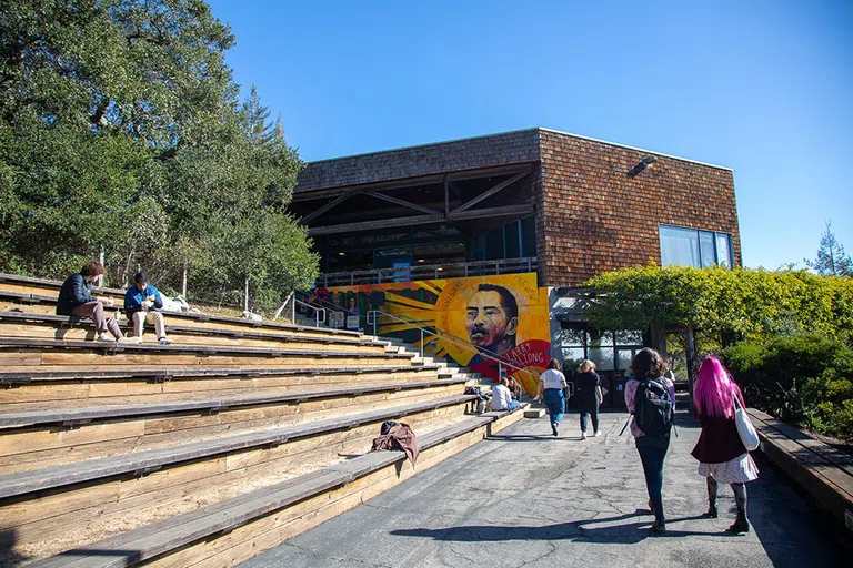 Bench seating, a building, and a mural