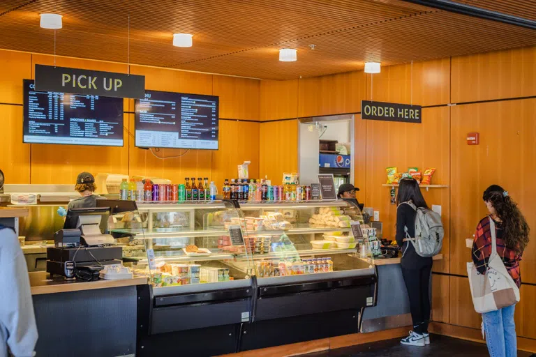 Student orders food at a counter