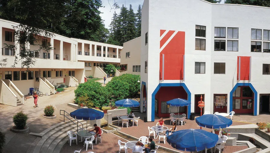 Exterior of Kresge College with outdoor tables