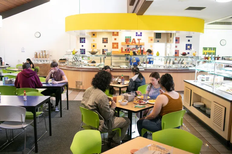 Students eat together in a dining hall