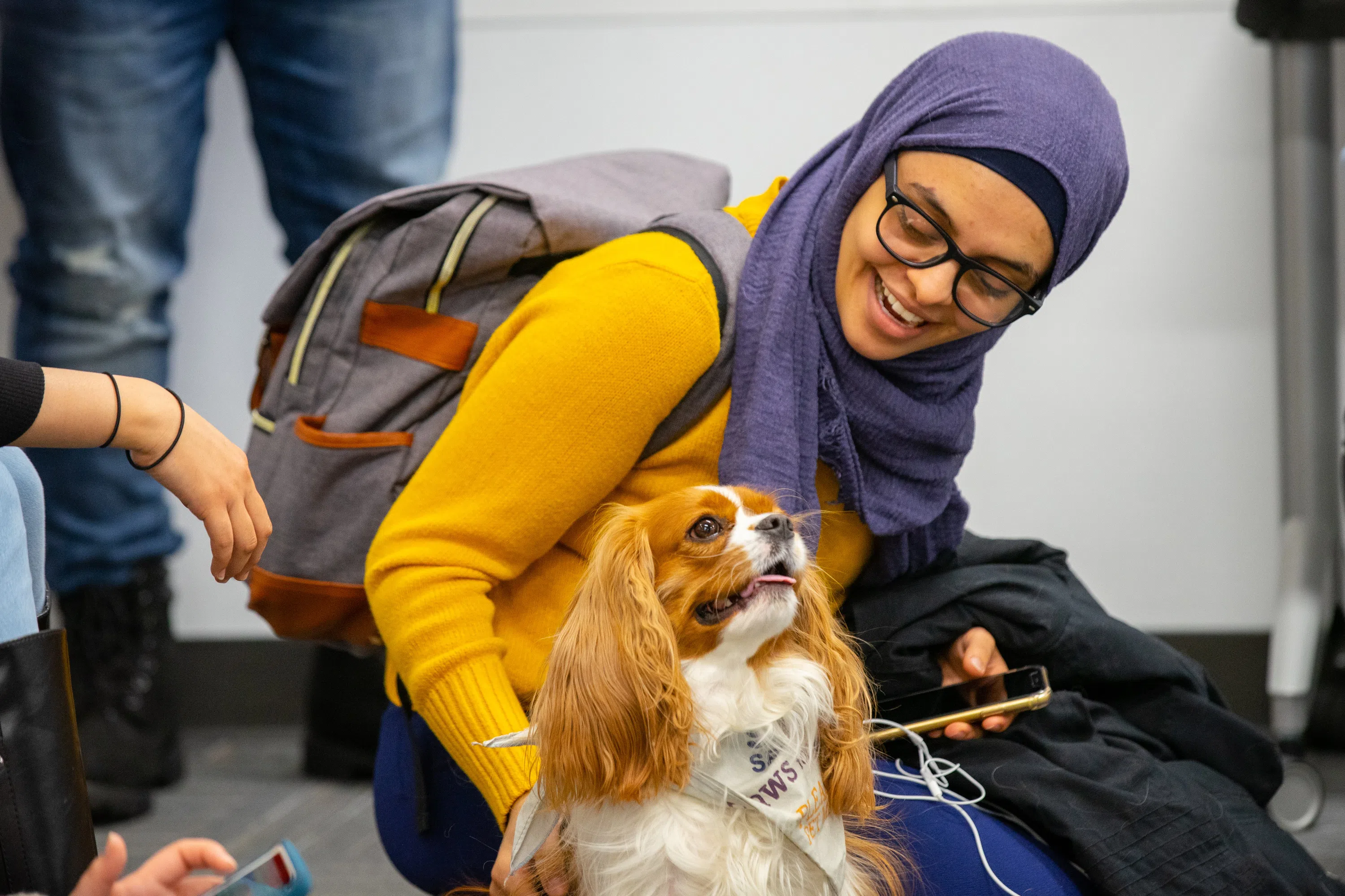 Students enjoy stress-relief activities including therapy dogs.