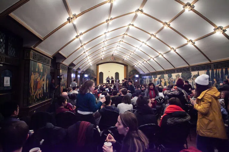 A crowd of students await a stage performance