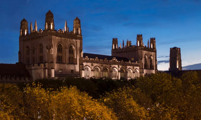 Ext of Harper library towers at sunset