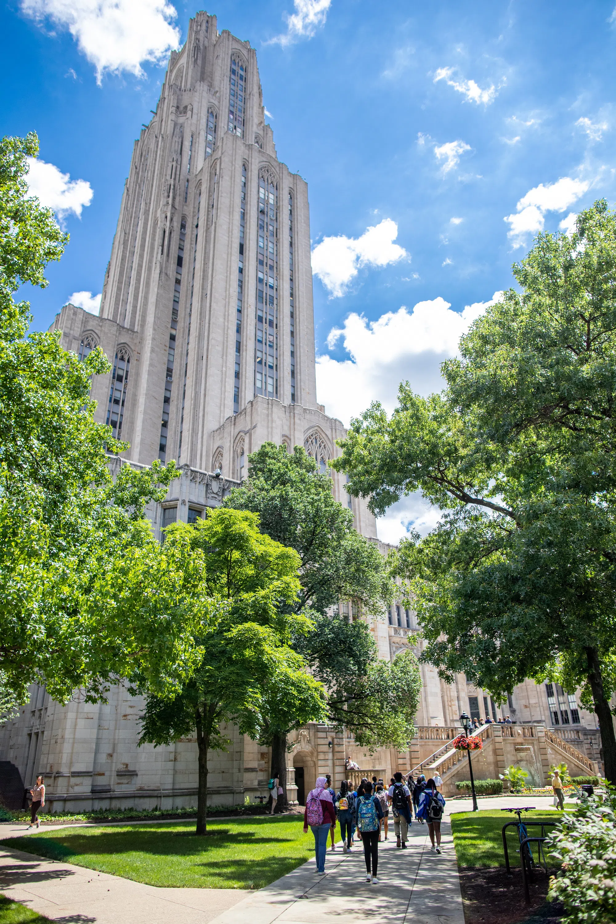 Students walking towards to iconic Cathedral of Learning