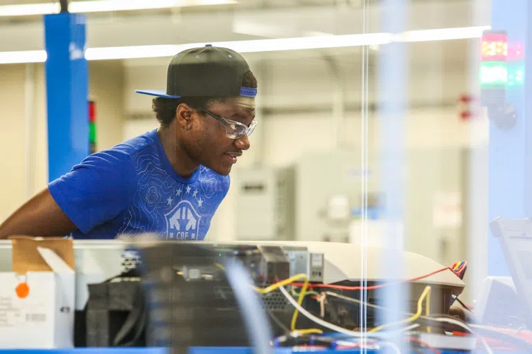 student in the Electric Power Systems Lab