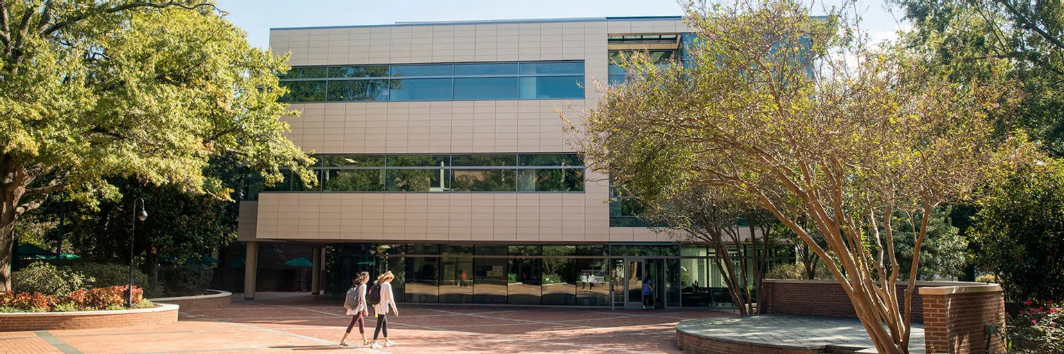 Students walking in front of the Center for Health and Well-Being.