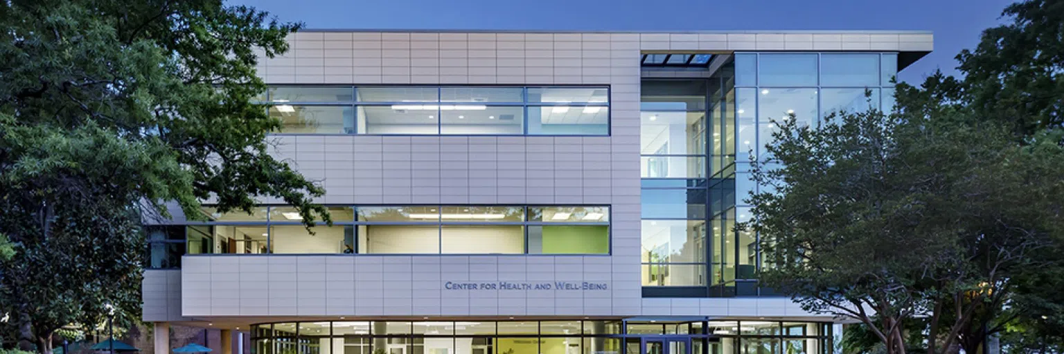 View of the front of the Center for Health and Well-Being during the evening