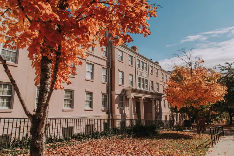 View of the front of East Quad during a fall day.