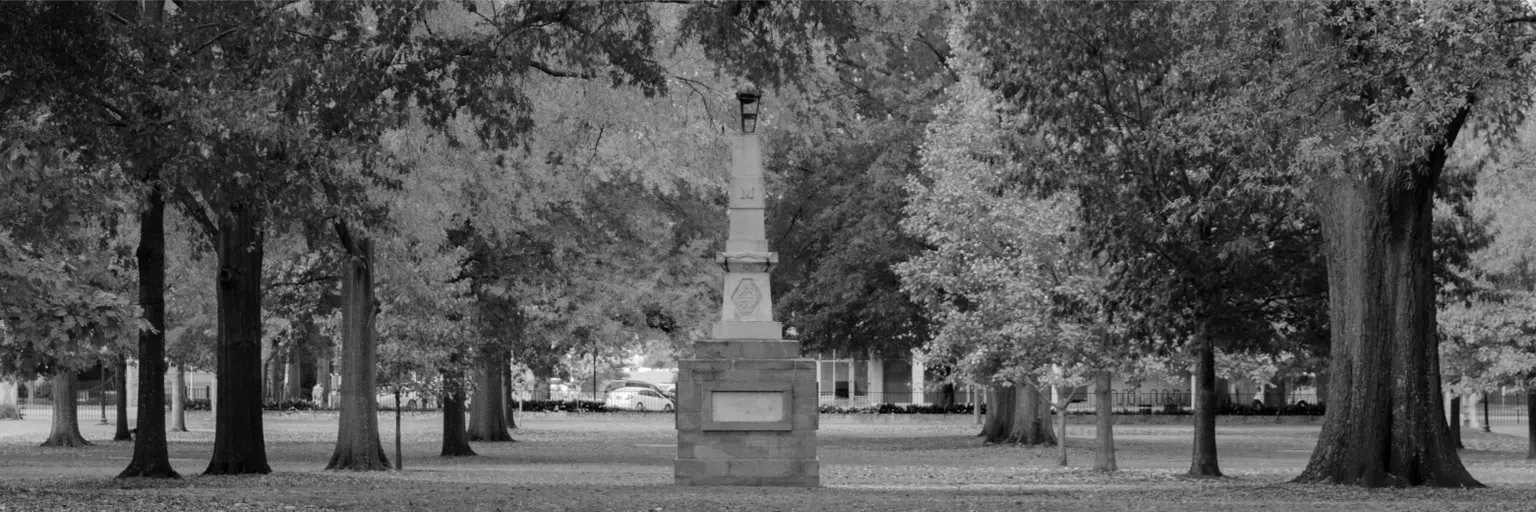 Black and white view of the Maxcy Monument on the UofSC Horseshoe.