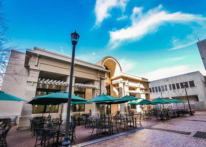 View of the front of Colloquium Café during the day